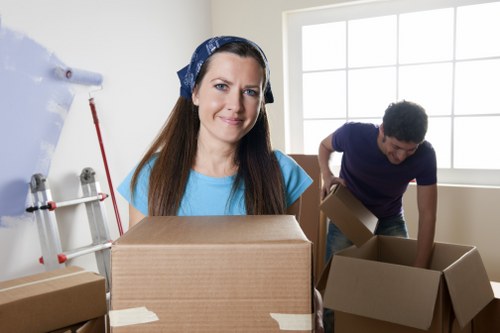 Careful loading of household items by a local removals team in Mitcham